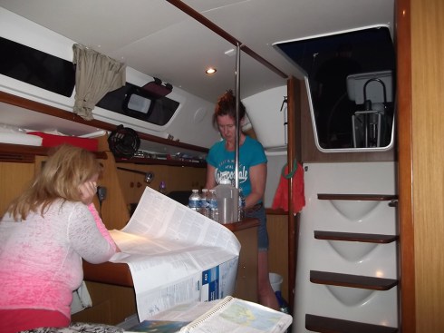 Jennifer works on navigation while I prepare dinner in the galley.