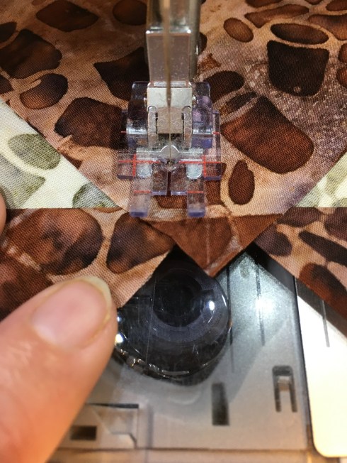 Your sewing lines will go right through the “V” where the sky patches intersect