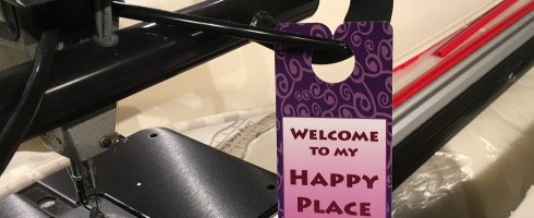 My door-hanger on my longarm machine in my sewing room