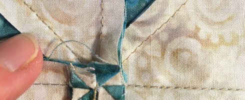 Pull the pinwheel apart. The vertical stitches in the seam allowance will come undone - this is okay!