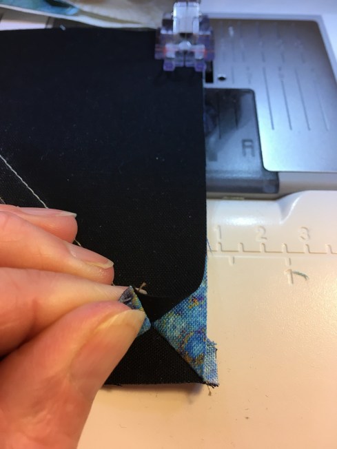 The angled seams in the half-square triangle units nest for perfect points