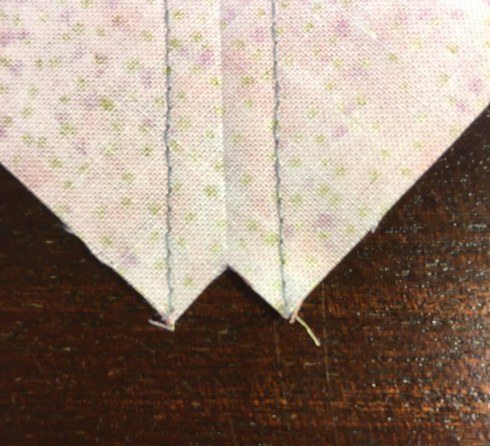 I trim a little square out of the corner on each end of the diagonal cutting line