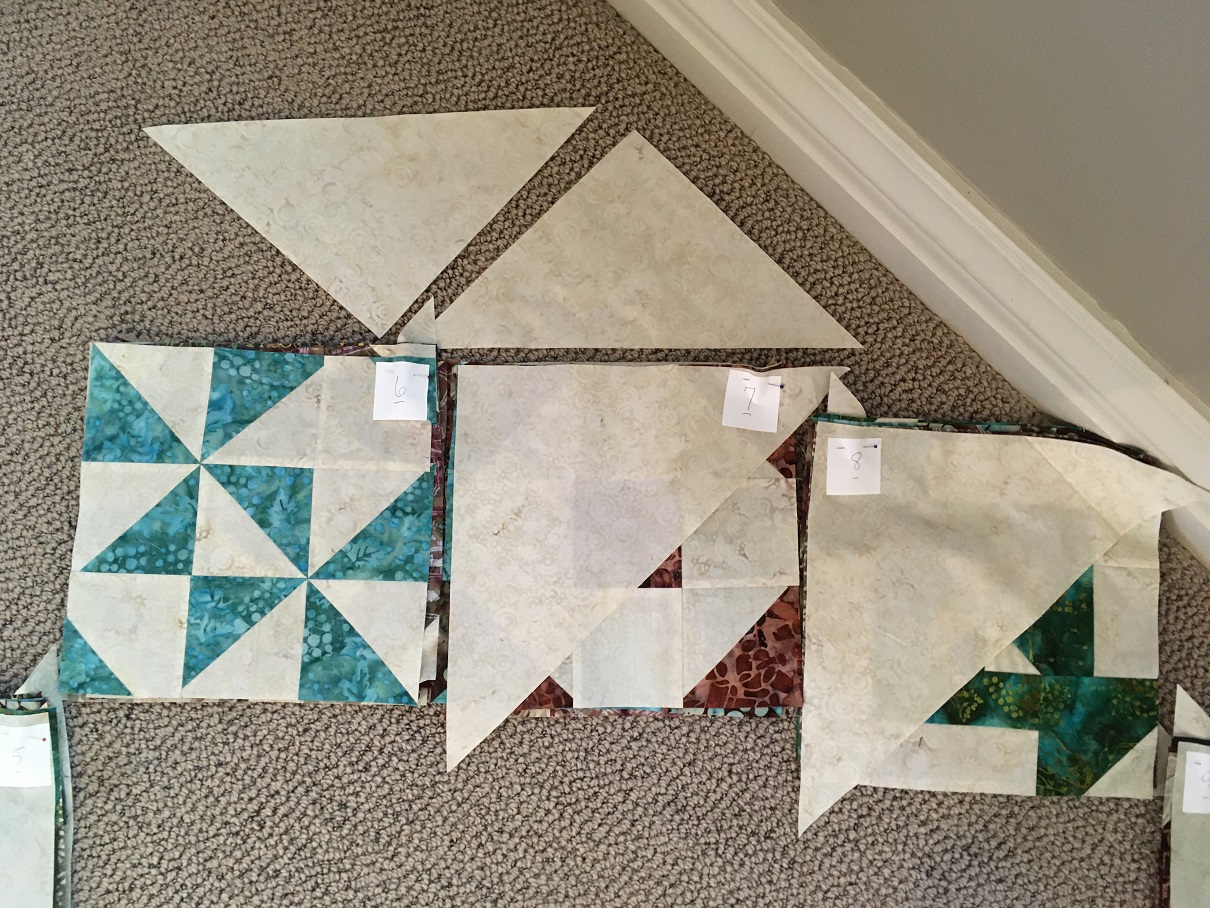 The bottom triangle from Stack 6 and top corner from Stack 7 are set aside and attached at the end