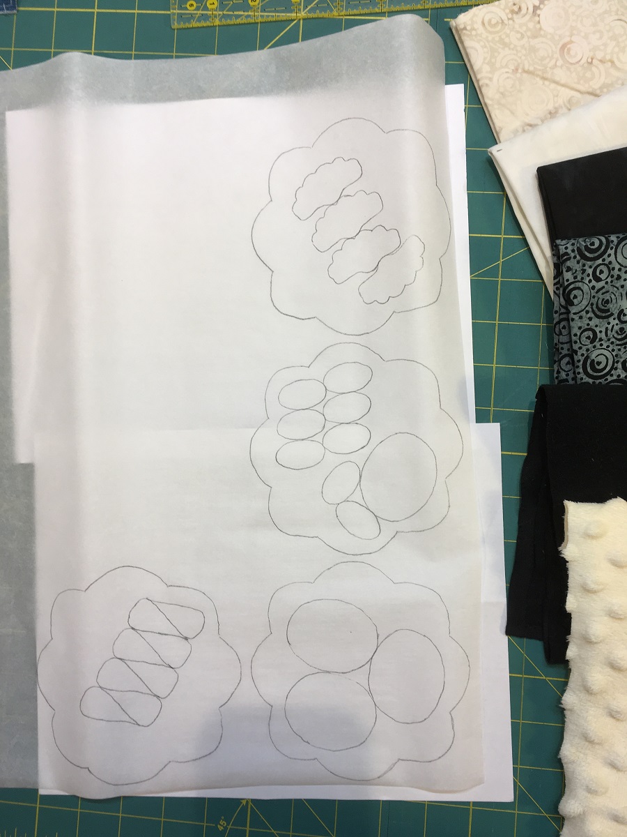 I traced my smaller pieces inside the larger pieces since I would be trimming out the center of the larger pieces