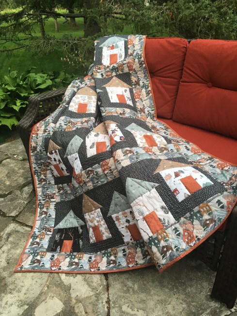 Ski Village quilt made with Winter Frost by Sara Boccaccini for FIGO, featured in Quilter's World