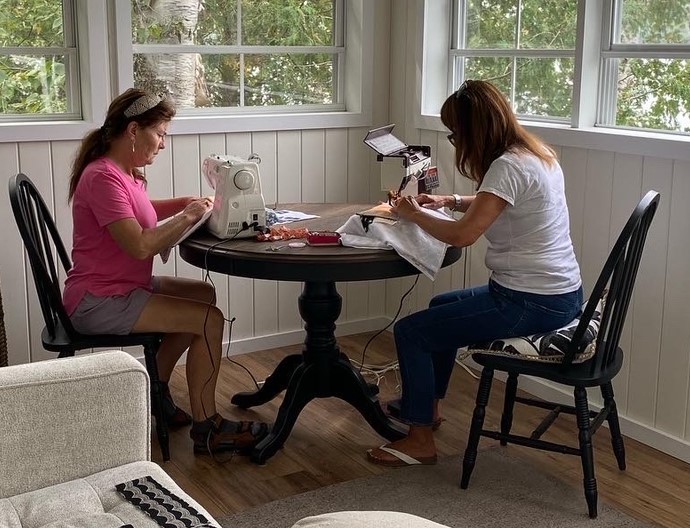 Cathy and Elaine focusing on their sewing